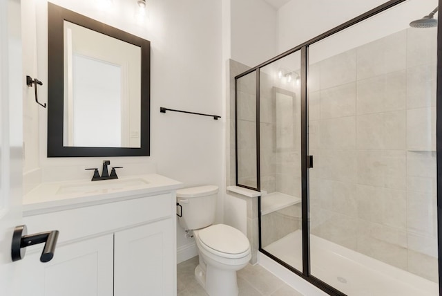 bathroom with tile patterned flooring, a shower with door, vanity, and toilet