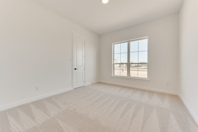 empty room featuring light colored carpet