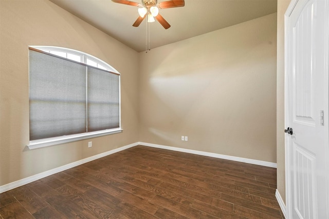 unfurnished room featuring dark hardwood / wood-style floors, ceiling fan, and vaulted ceiling