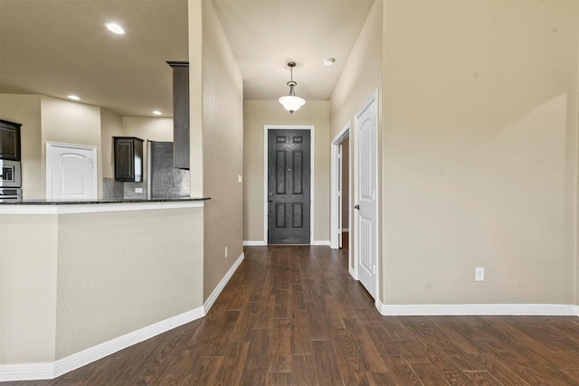 foyer featuring dark wood-type flooring