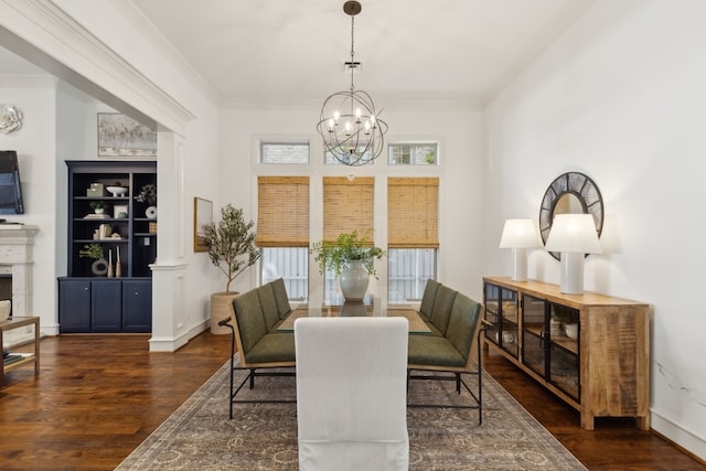 dining space featuring crown molding, dark hardwood / wood-style flooring, and a chandelier