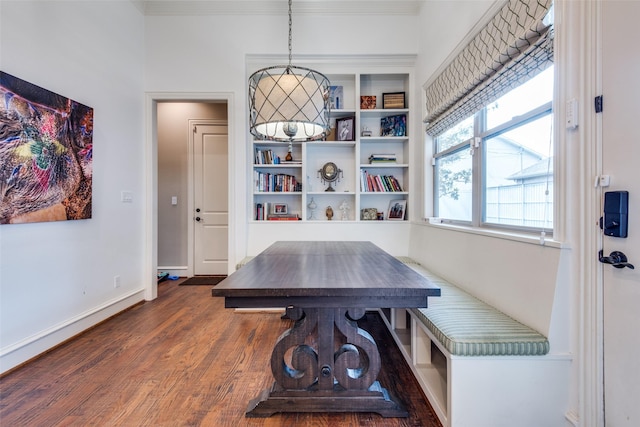 dining area featuring breakfast area and dark wood-type flooring