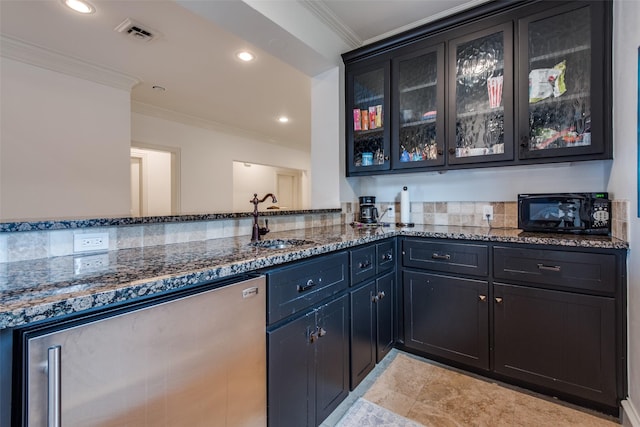 bar with dishwasher, dark stone countertops, ornamental molding, and sink