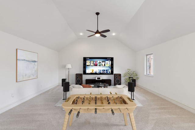 carpeted living room featuring ceiling fan and lofted ceiling