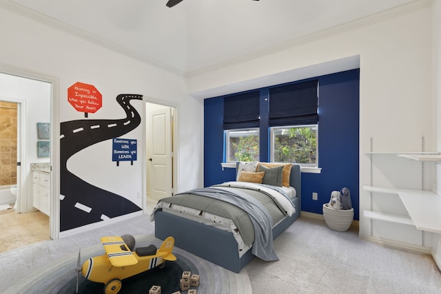 carpeted bedroom with connected bathroom, ceiling fan, and ornamental molding