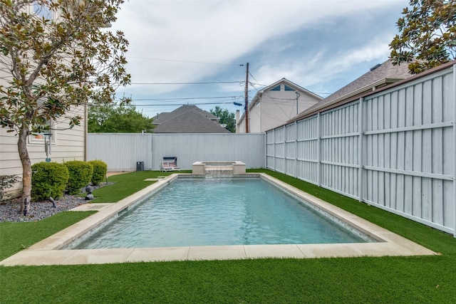 view of pool featuring an in ground hot tub and a yard