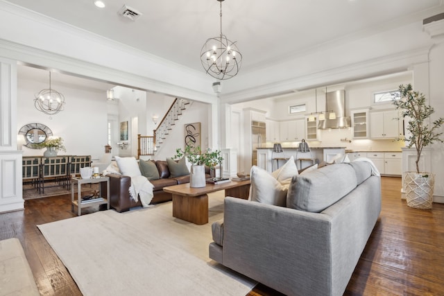 living room featuring dark hardwood / wood-style flooring and crown molding