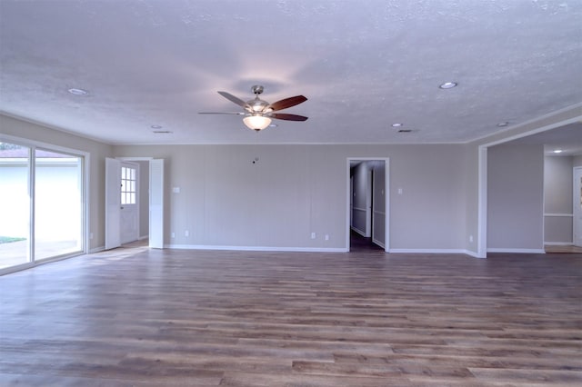 unfurnished room featuring dark hardwood / wood-style floors, a textured ceiling, and ceiling fan