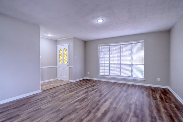 unfurnished room with dark hardwood / wood-style floors