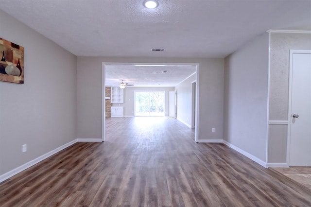 interior space with hardwood / wood-style flooring, ceiling fan, and a textured ceiling