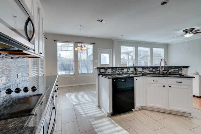 kitchen featuring black appliances, decorative backsplash, white cabinets, and sink