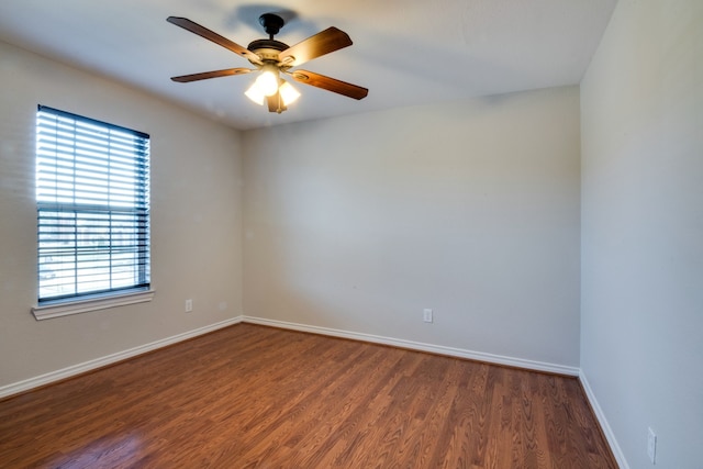 unfurnished room featuring ceiling fan and dark hardwood / wood-style flooring