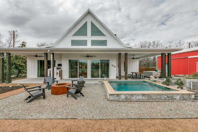 rear view of house featuring a patio, ceiling fan, and an outdoor fire pit