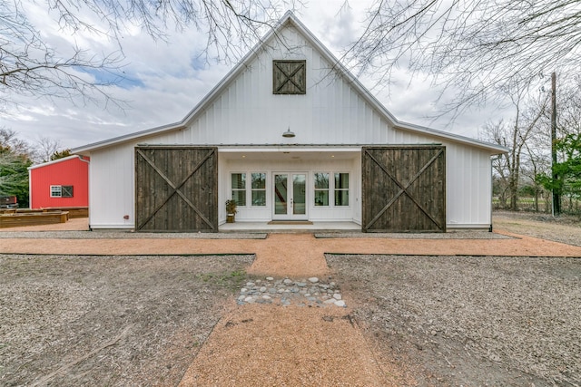 back of property with an outbuilding