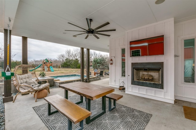 view of patio / terrace with ceiling fan, a swimming pool, and an outdoor living space