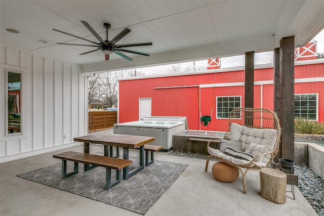 view of patio featuring a hot tub and ceiling fan