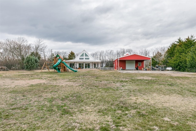 view of yard with an outbuilding and a playground