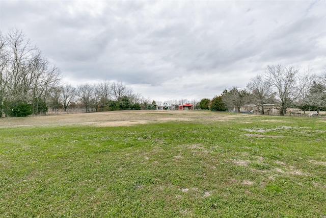 view of yard with a rural view