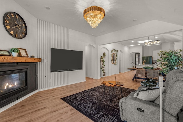 living room featuring a chandelier and hardwood / wood-style floors