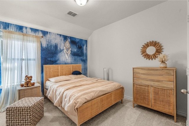 carpeted bedroom featuring lofted ceiling