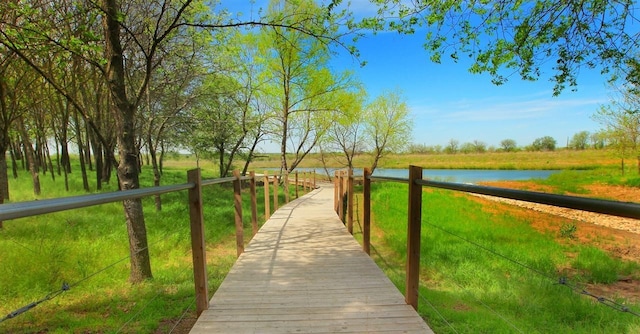 view of home's community with a rural view and a water view