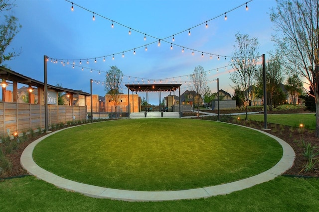 yard at dusk with a pergola