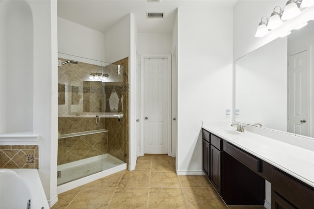 bathroom with vanity, independent shower and bath, and a chandelier