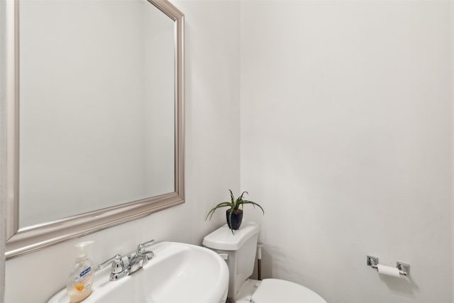 bathroom featuring sink and toilet