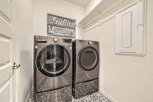 laundry room featuring independent washer and dryer and tile patterned floors