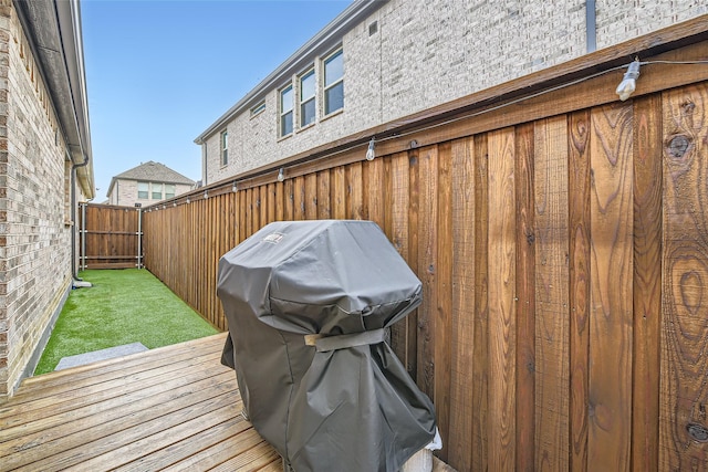 wooden deck with area for grilling