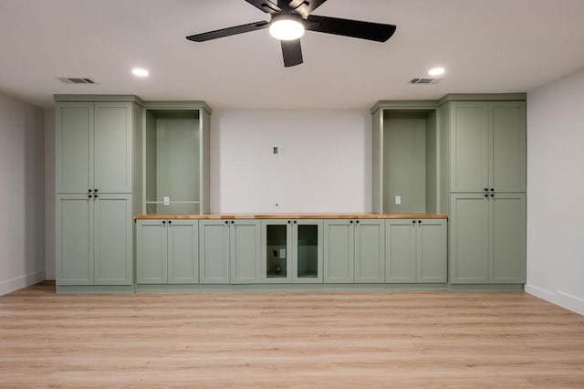 empty room featuring light hardwood / wood-style flooring and ceiling fan