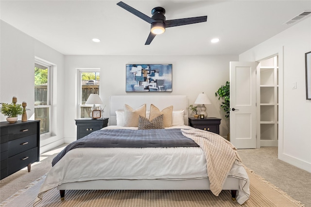 bedroom with ceiling fan and light colored carpet