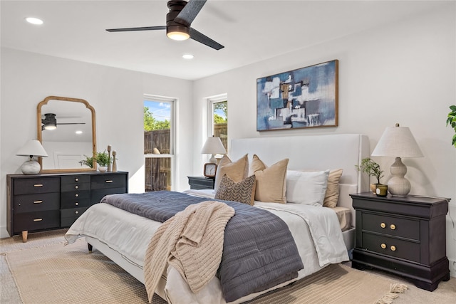 carpeted bedroom with ceiling fan