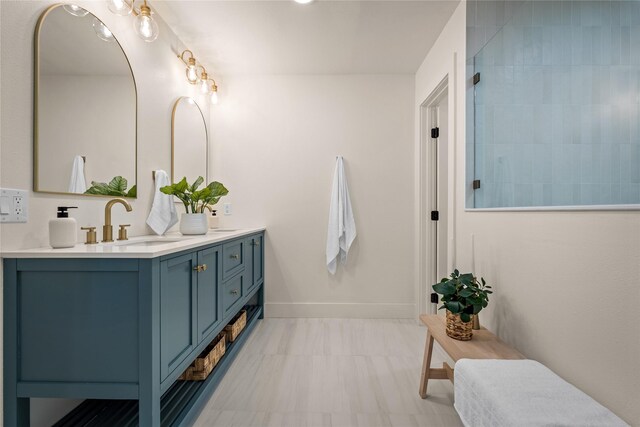 bathroom featuring a shower and vanity