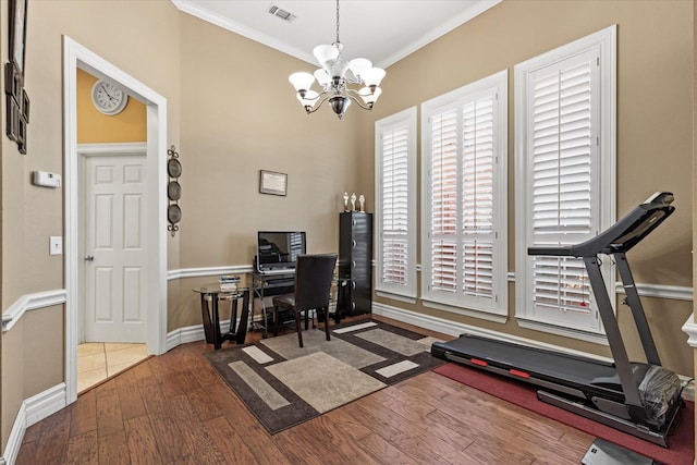 home office featuring ornamental molding, an inviting chandelier, and dark wood-type flooring