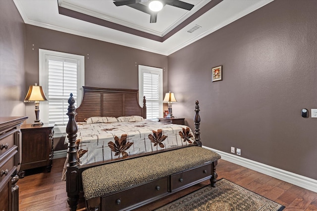 bedroom with ceiling fan, dark hardwood / wood-style floors, and ornamental molding