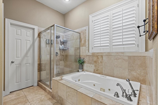 bathroom featuring tile patterned flooring and independent shower and bath