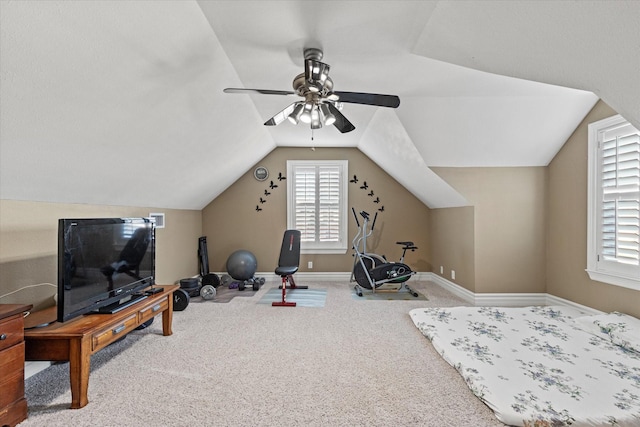 workout room featuring carpet floors, vaulted ceiling, and ceiling fan