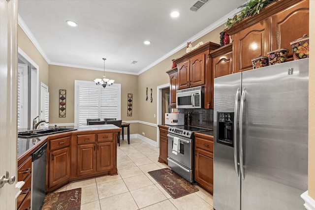 kitchen with sink, stainless steel appliances, a notable chandelier, pendant lighting, and light tile patterned flooring