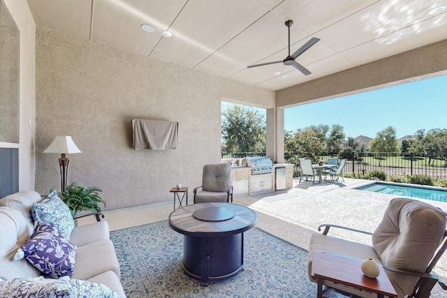 view of patio with a grill, area for grilling, a fenced in pool, and ceiling fan