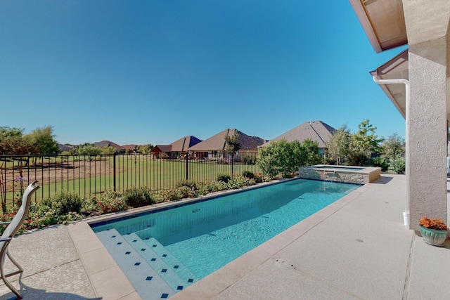 view of swimming pool featuring an in ground hot tub