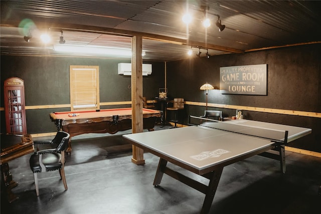 game room with a wall unit AC, concrete flooring, and pool table