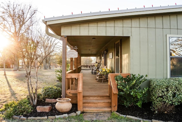 deck with covered porch and fence