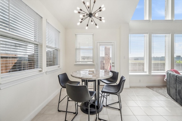 dining space featuring a chandelier and light tile patterned floors