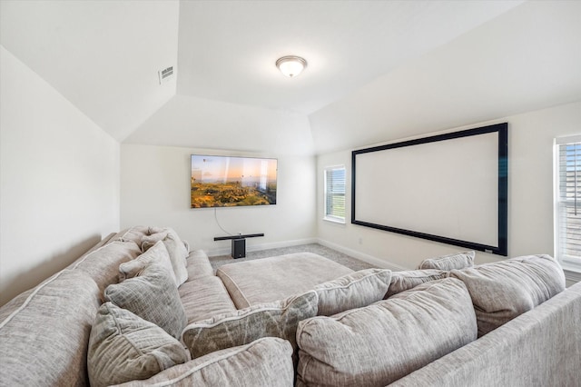 cinema featuring carpet flooring, plenty of natural light, and lofted ceiling