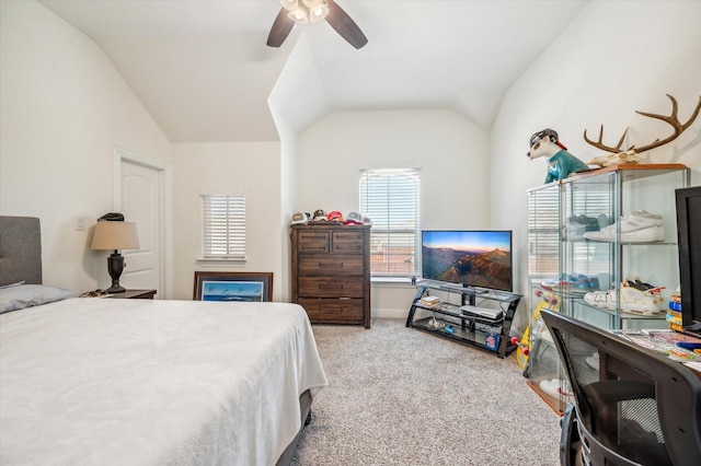 bedroom with ceiling fan, light carpet, and vaulted ceiling