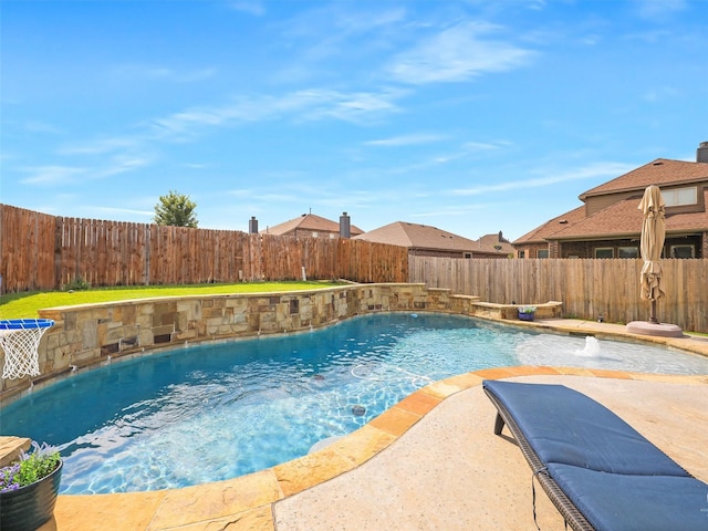 view of swimming pool with pool water feature