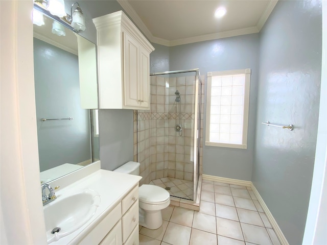 bathroom featuring crown molding, toilet, vanity, and a shower with shower door