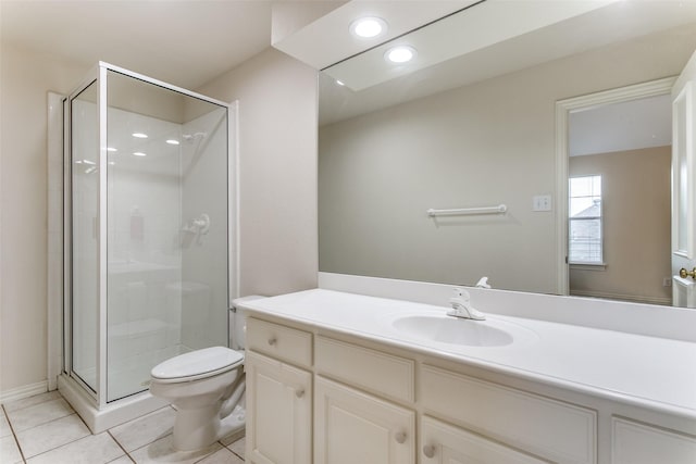 bathroom with vanity, toilet, a shower with shower door, and tile patterned flooring