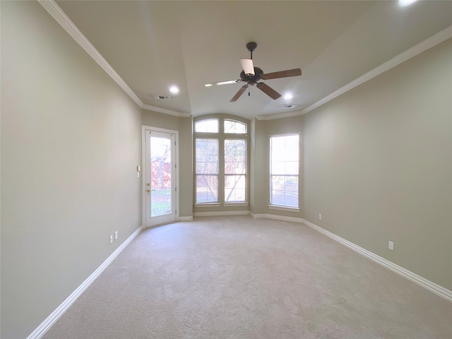 carpeted empty room with ornamental molding and ceiling fan